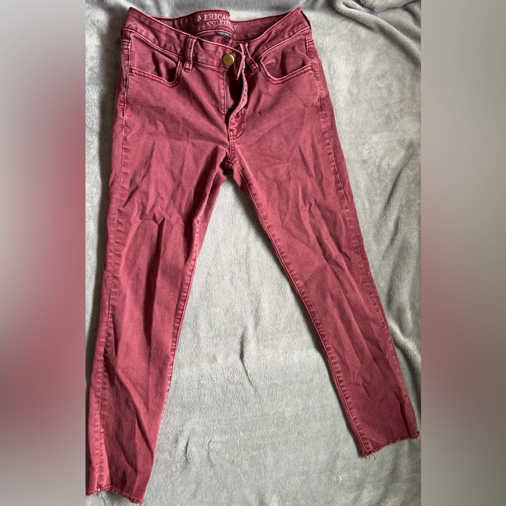 American Eagle outfitters burgundy skinny jeans.